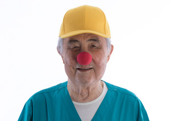Red Nose Day, portrait of an old man with a red clown nose