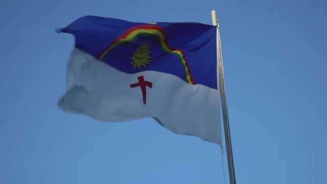 Beautiful flag of Pernambuco state waving in the wind on sunny summer day with blue sky. Concept of state, symbol, republic, Brazil, cultural identity, democracy, geography and politics.