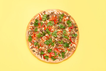 Flat lay delicious pizza isolated on bright yellow background with a copy space