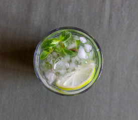Cocktail mojito with lime, mint and ice. Recipe. Alcohol. Summer drink. Vegetarianism. Health.