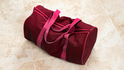 a big bag on the floor full of clothes and accessories, ready  to start the travel wide web banner