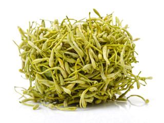 dried honeysuckle flowers on the white background 