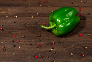 Bulgarian green peppers on a wooden background