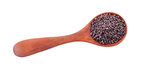 Black mustard in a spoon on a white background