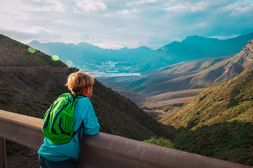 Fototapeta premium boy travel in mountains, kids looking at scenic view