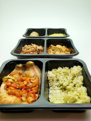 Containers with useful food on an isolated background. Delivery service.