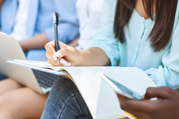 Unrecognizable Student Girl Preparring For Classes, Writing In Workbook, Taking Notes