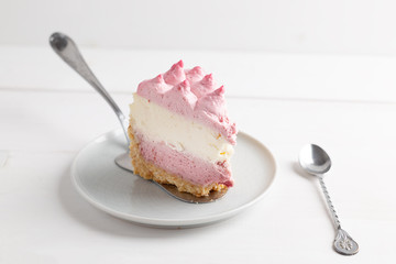 Delicious homemade cheesecake with berries on wooden table.