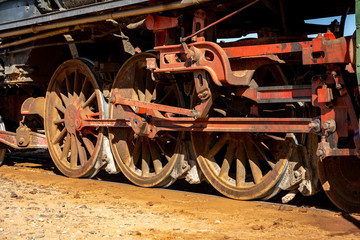 Fototapeta na wymiar Closeup of the old locomotive wheels