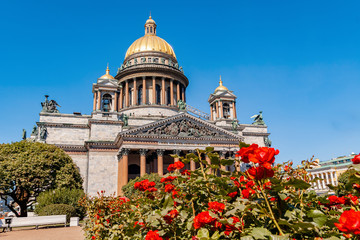 View of St. Isaac's Cathedral in St. Petersburg with red roses in front of it