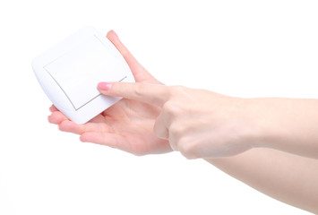 electric switch button in hand on white background isolation