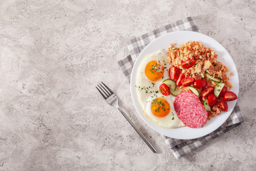 ketogenic paleo diet breakfast. cauliflower rice, fried egg salami