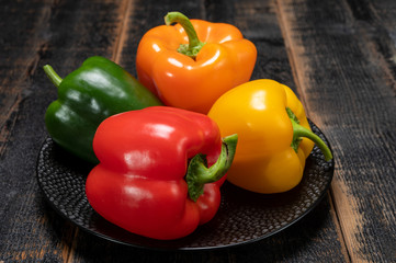 Fresh red, orange, green and yellow sweet bell paprika