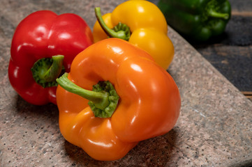 Fresh red, orange, green and yellow sweet bell paprika