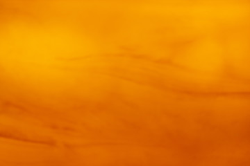 Abstract orange soft colorful smooth blurred background texture off focus toned. Use as wallpaper or for web design .