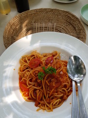 Closeup of delicious spaghetti with minced pork in tomato sauce.  Popular food concept.