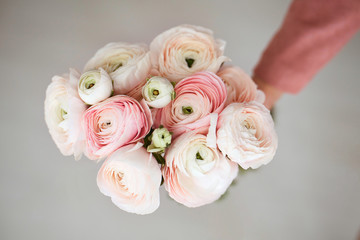 A bouquet of delicate pink ranunculuses. The view from the top.