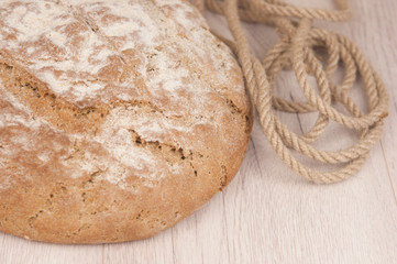 Round loaf of freshly backed sourdough bread, with copy space