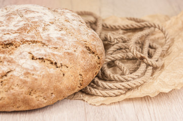 Round loaf of freshly backed sourdough bread, with copy space