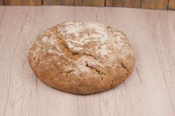 Round loaf of freshly backed sourdough bread, with copy space