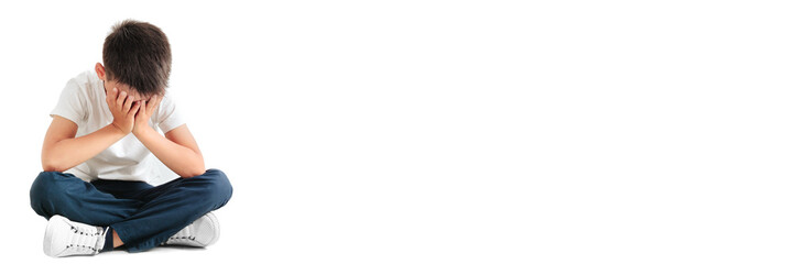 a child whose depression is sitting on the floor