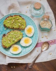 Healthy toast with avocado cream and egg