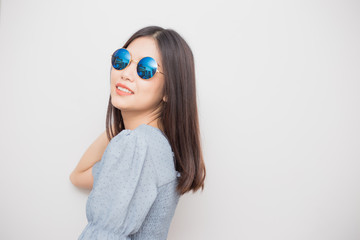 Fashion portrait of smiling beautiful women with sunglass posting on white background