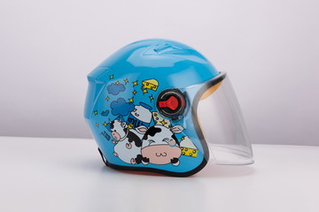 Cute blue cartoon motorcycle helmet with wind shield and sun visor, classic helmet isolated on...