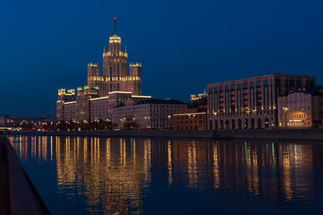 View of illuminated skyscraper on the Kotelnicheskaya embankment and Moscow River at night