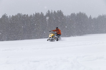 Athlete on a snowmobile.