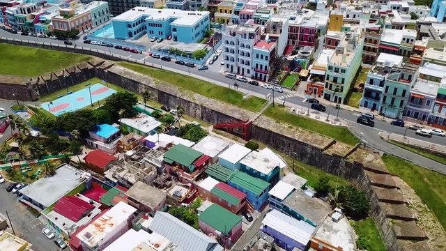 Aerial, drone shot overlooking buildings and architecture, in San Juan city, on a sunny day, in Puerto Rico, USA