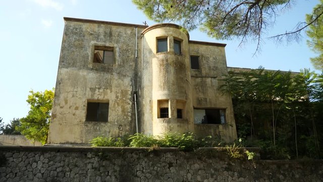 Low angle view of the side of an abandoned sanatorium in Eleousa village, Rhodes Island, Greece