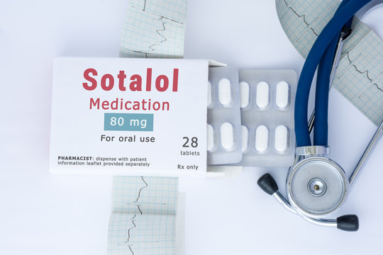 Sotalol medication concept photo. On doctor table is package of cardiac drug with pills and generic name "Sotalol medication" next to stethoscope and electrocardiogram