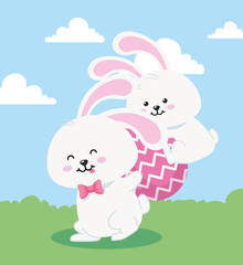 rabbits with egg easter in landscape vector illustration design