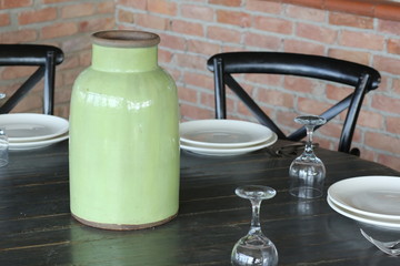 green ceramic jar on the table