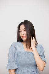 Obraz premium Beautiful smile asian young woman touching on hair with clean and fresh skin Happiness and cheerful with positive emotional on white background