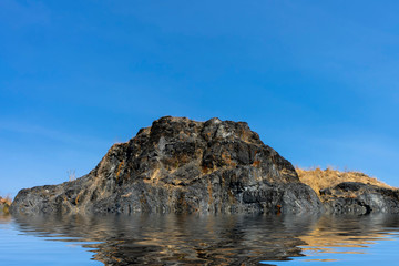Fototapeta na wymiar Granite mountains with blue sky background.