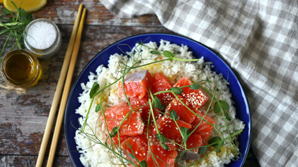 Selective focus. Poke bowl with salmon and microgreens. Healthy food.