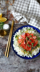 Selective focus. Poke bowl with salmon and microgreens. Healthy food.
