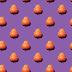 Seamless pattern with red pears on violet background. Flat lay composition