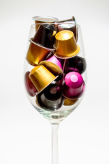 Glass cup with coffee capsules