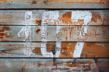 An ancient wooden background with dry peeling paint. Vertically located boards. Can be used as a background, design element, photo background.