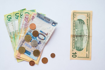 Belarusian money and dollar bills for financial and investment concepts.