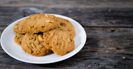 Cashew cookies In a plate on a wooden table