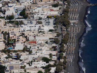 Beaches and promenade, view of Kamari village, aerial view from Mesa Vuono mountain on Santorini island, Greece