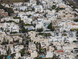 Fototapeta na wymiar Kamari village, aerial view from Mesa Vouno mountain on Santorini island, Greece