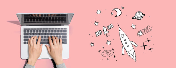 Dream of space and rocket with person using a laptop computer