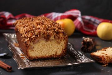 Homemade cupcake with oatmeal, apples and crunchy cereals oatmeal on a metal tray on a dark background