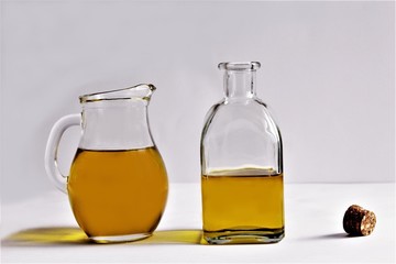 Glass jar and glass olive oil bottle photo isolate on white front view copy space t view 
