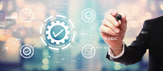 Quality control approval with businessman on blurred abstract background